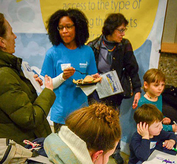 Children coloring at an event